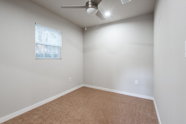 carpeted empty room featuring ceiling fan