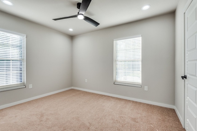 carpeted empty room with ceiling fan