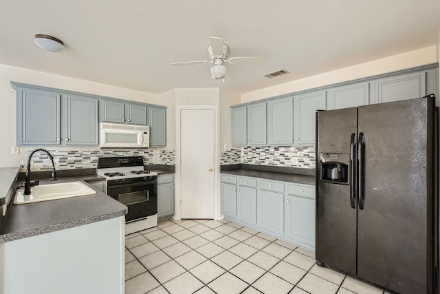 kitchen featuring tasteful backsplash, sink, white appliances, light tile patterned floors, and ceiling fan