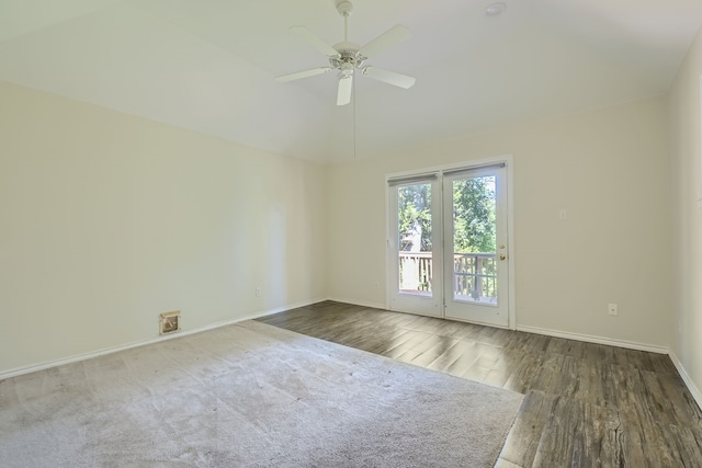 unfurnished room featuring lofted ceiling, dark hardwood / wood-style floors, and ceiling fan