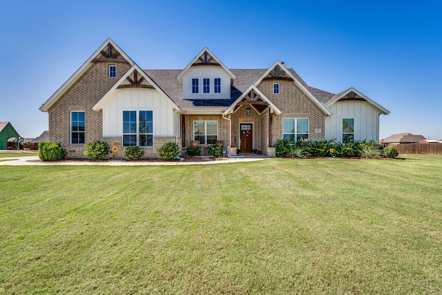 craftsman-style house with a front yard