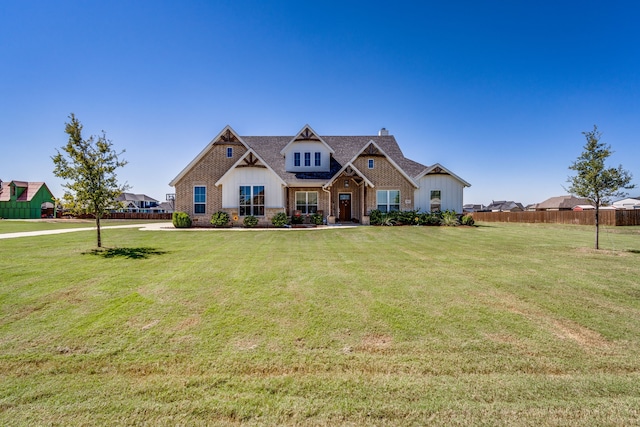 craftsman-style house featuring a front yard