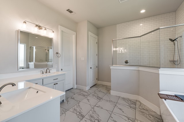 bathroom featuring independent shower and bath and vanity