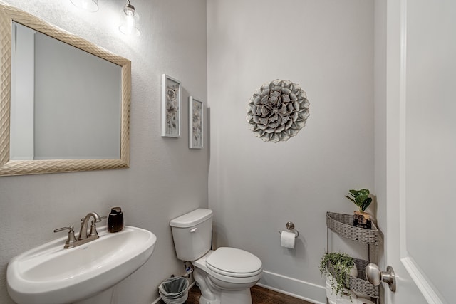 bathroom featuring sink and toilet