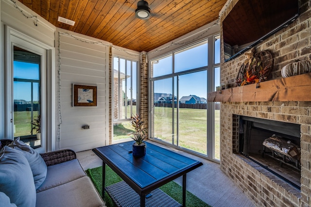 living room with a fireplace and wooden ceiling