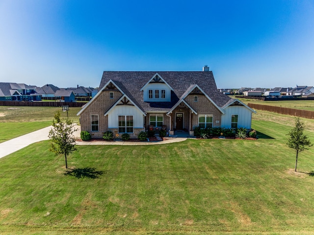 craftsman-style house featuring a front lawn