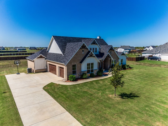 craftsman-style home featuring central air condition unit and a front yard