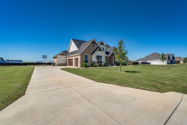 view of front of home with a garage and a front lawn