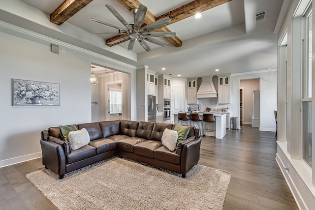 living room featuring beam ceiling, dark hardwood / wood-style floors, ceiling fan, and radiator