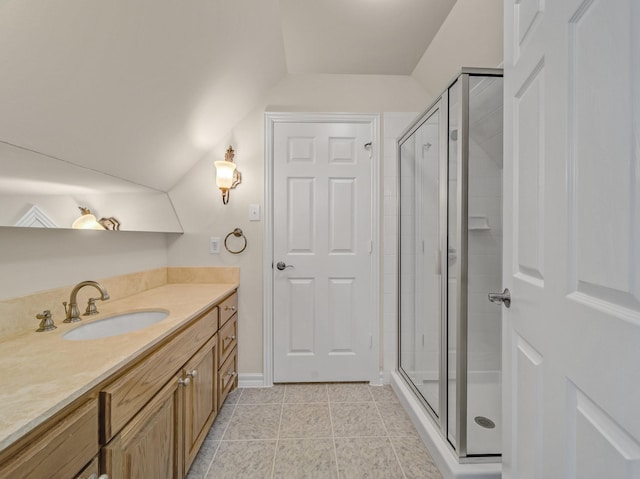 bathroom featuring a stall shower, tile patterned floors, and vanity