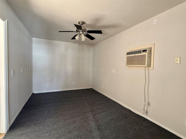 spare room featuring a wall unit AC, ceiling fan, dark carpet, and baseboards