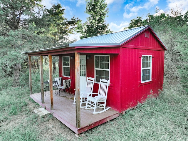 view of outbuilding with a lawn