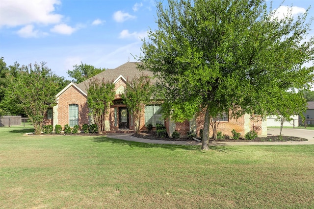 obstructed view of property featuring a front yard