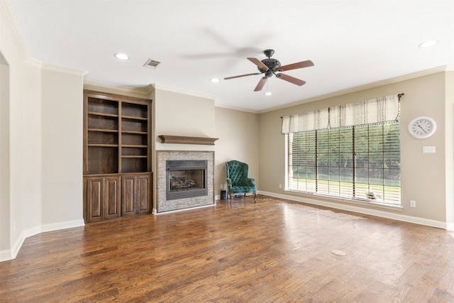 unfurnished living room with crown molding, hardwood / wood-style flooring, and ceiling fan