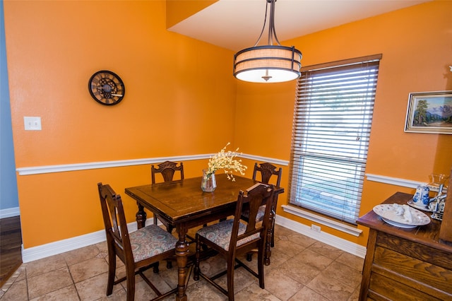 dining space with light tile patterned flooring