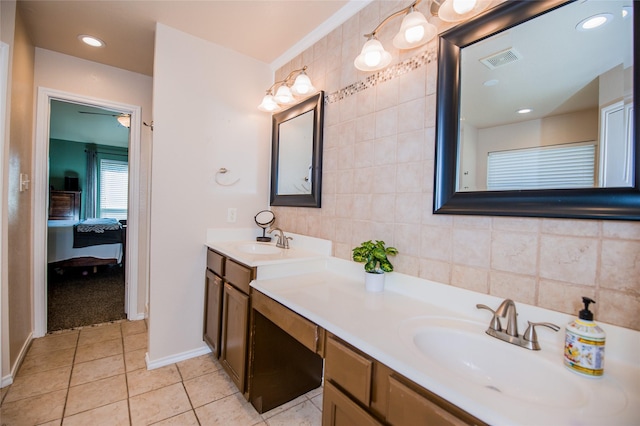 bathroom featuring visible vents, ensuite bath, tile patterned floors, vanity, and tile walls