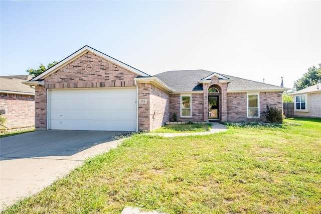 single story home featuring driveway, a garage, roof with shingles, a front yard, and brick siding