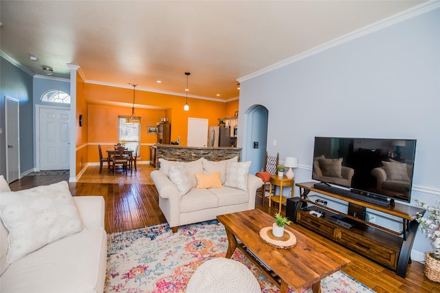 living room with hardwood / wood-style flooring and ornamental molding