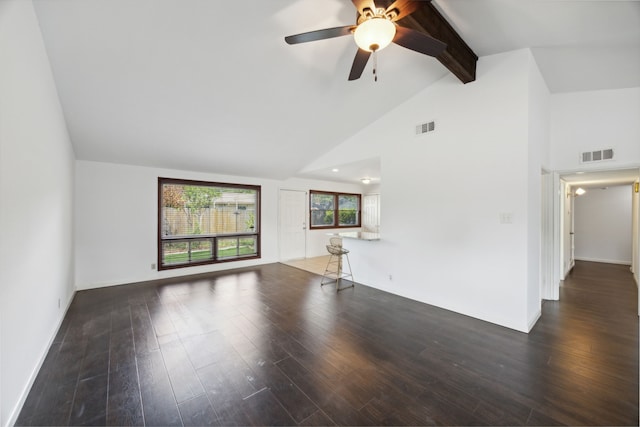 unfurnished living room with ceiling fan, beamed ceiling, dark hardwood / wood-style flooring, and high vaulted ceiling