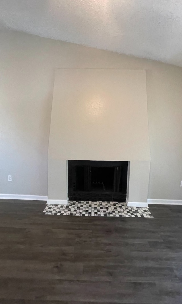 details featuring a textured ceiling and hardwood / wood-style floors