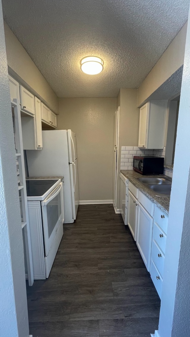 kitchen with white cabinetry, dark wood-type flooring, and white electric range