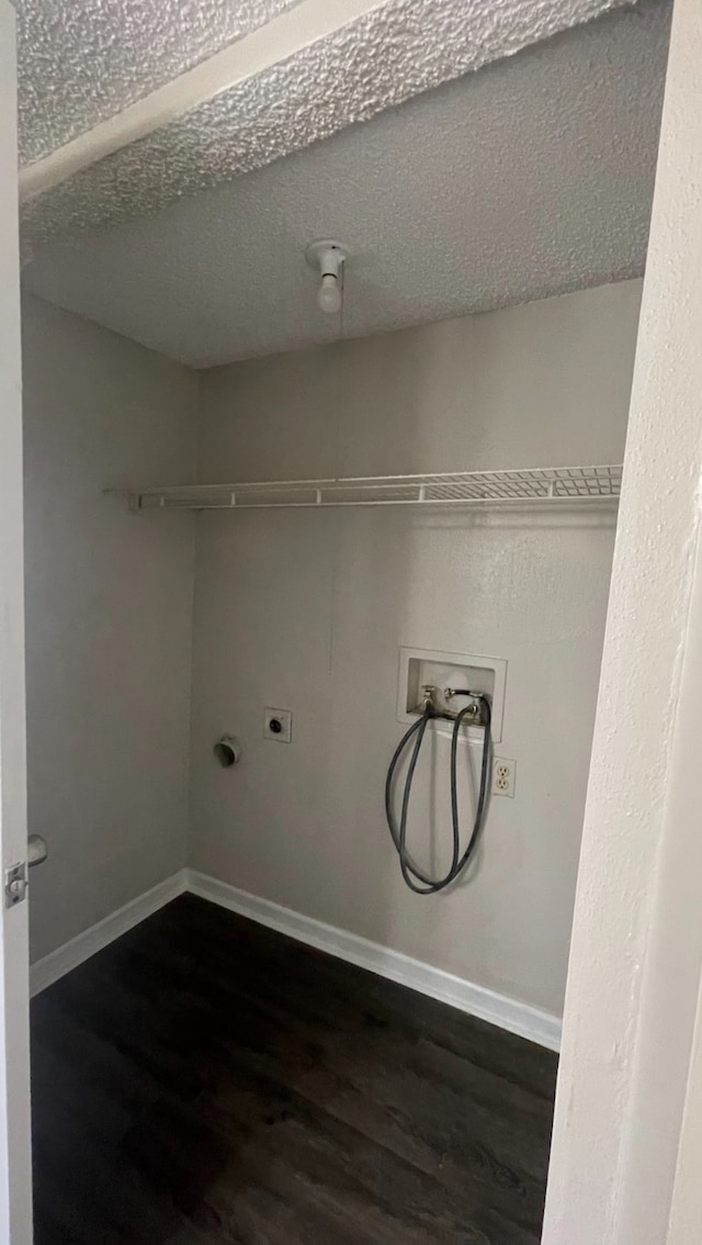 clothes washing area featuring hookup for a washing machine, dark hardwood / wood-style floors, and hookup for an electric dryer