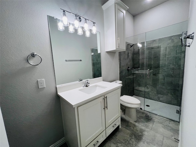 bathroom featuring vanity, toilet, and a shower with door