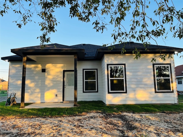 back of property featuring a patio