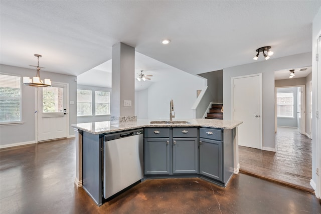 kitchen featuring dishwasher, a center island with sink, and a healthy amount of sunlight