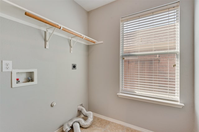 clothes washing area featuring hookup for a washing machine, light tile patterned flooring, and hookup for an electric dryer