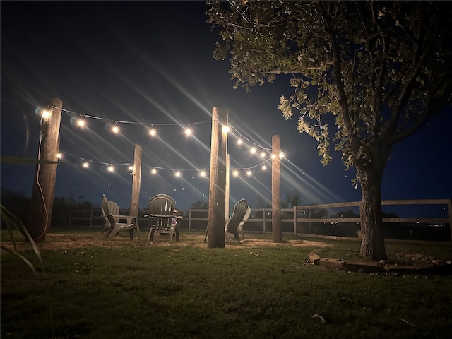 view of yard at twilight