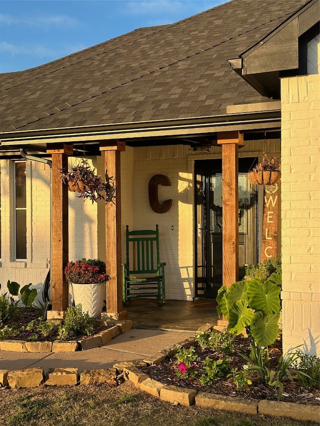 doorway to property featuring covered porch