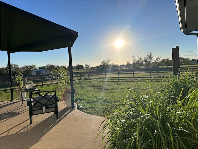 view of yard featuring a patio and a rural view