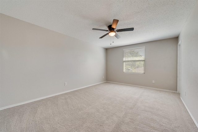 1200 Scenic Hills Dr, Mckinney, TX 75071 - empty room with light carpet, baseboards, a ceiling fan, and a textured ceiling