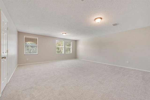 1200 Scenic Hills Dr, Mckinney, TX 75071 - empty room featuring visible vents, baseboards, and light colored carpet
