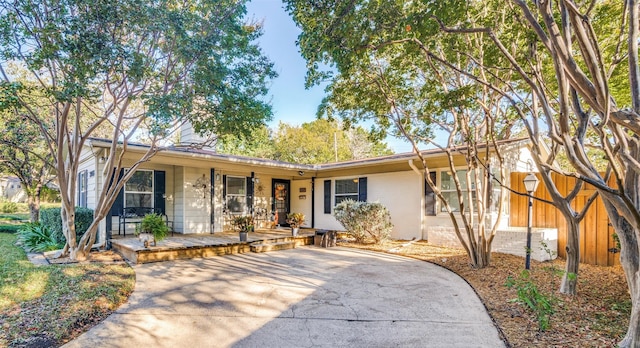 ranch-style home with covered porch