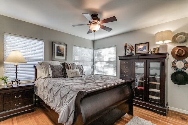 bedroom featuring light hardwood / wood-style flooring and ceiling fan