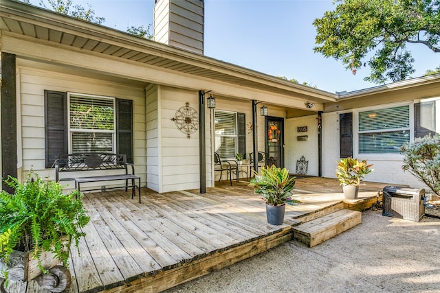 entrance to property with a wooden deck