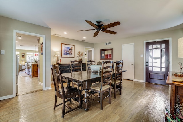 dining space featuring light hardwood / wood-style floors and ceiling fan