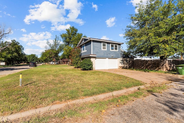 view of home's exterior featuring a lawn and a garage