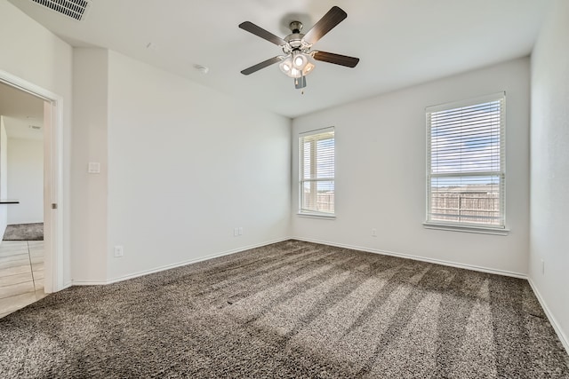 carpeted empty room with ceiling fan