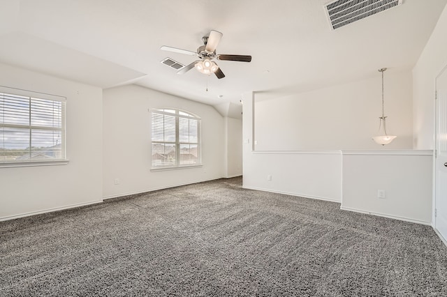 carpeted empty room featuring ceiling fan and vaulted ceiling