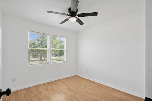 spare room featuring ceiling fan and light hardwood / wood-style flooring