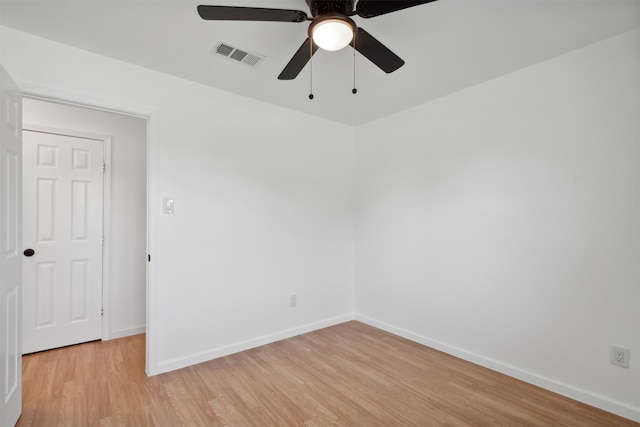 spare room featuring light hardwood / wood-style flooring and ceiling fan