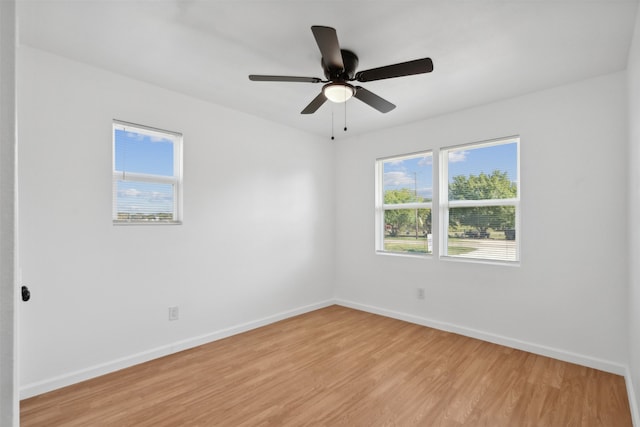 unfurnished room featuring light hardwood / wood-style flooring and ceiling fan