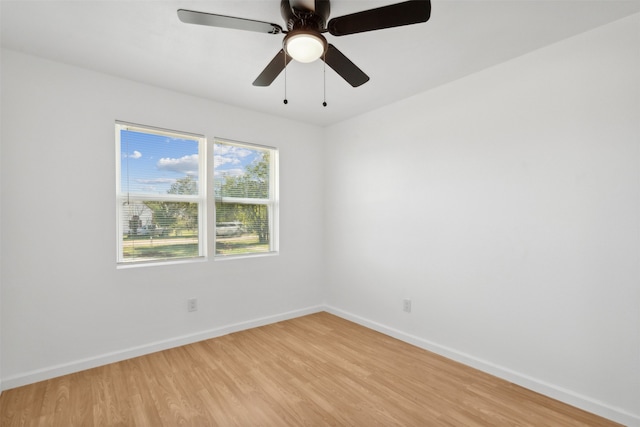 spare room featuring ceiling fan and light hardwood / wood-style floors