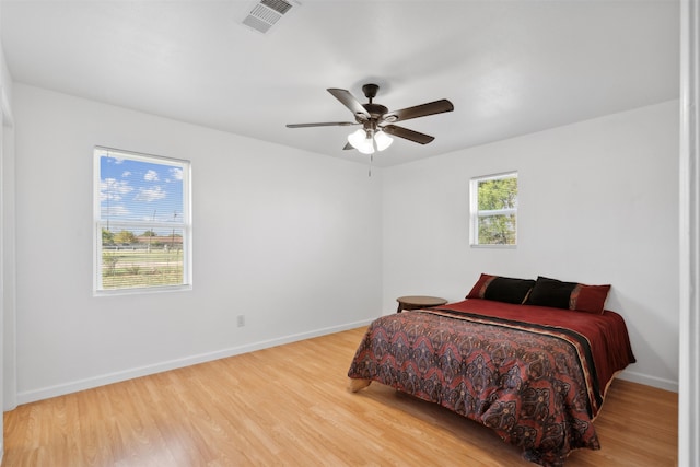 bedroom featuring hardwood / wood-style floors and ceiling fan