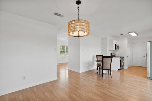 dining area featuring light hardwood / wood-style flooring