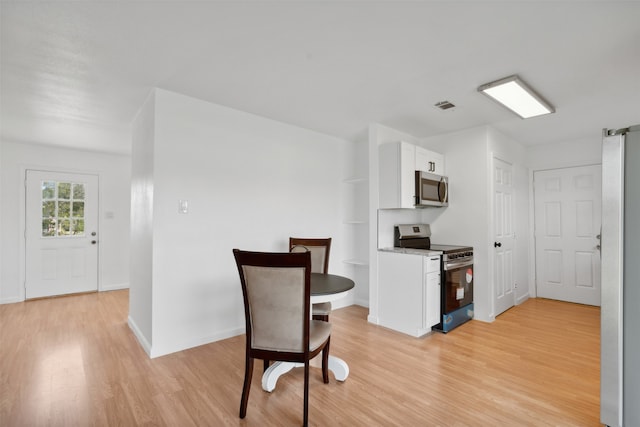 interior space with light hardwood / wood-style flooring