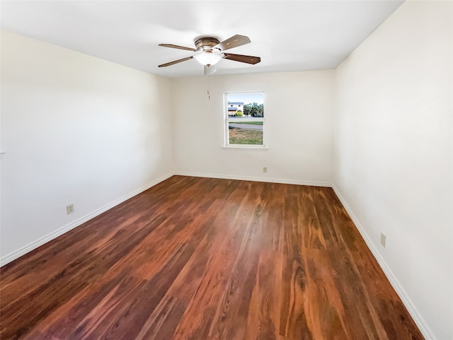 unfurnished room featuring dark hardwood / wood-style floors and ceiling fan